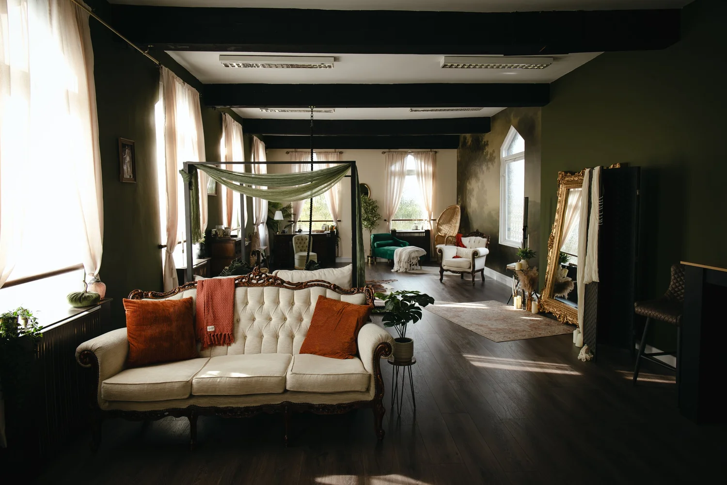 Tall windows, vintage seating and olive walls in the Great Baddow photography studio